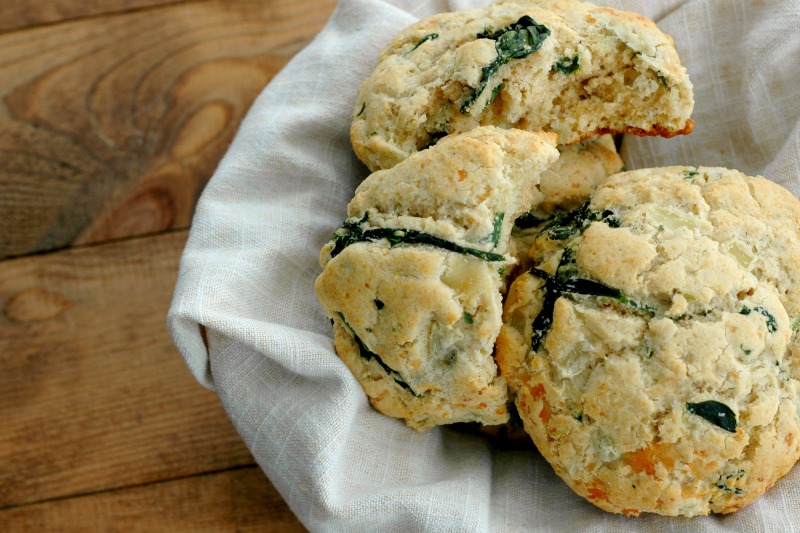 Gluten Free Savory Spinach & Cheese Breakfast Biscuits :: Soft and buttery inside, crisp cheesy outside, these savory spinach and cheese biscuits make the perfect breakfast topped with a fried egg, or just dripping with butter!
