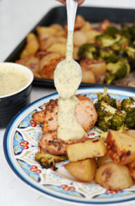 Sheet Pan Lemon Garlic Chicken, Potatoes, & Broccoli with Dairy Free "Cheesy" Herb Sauce